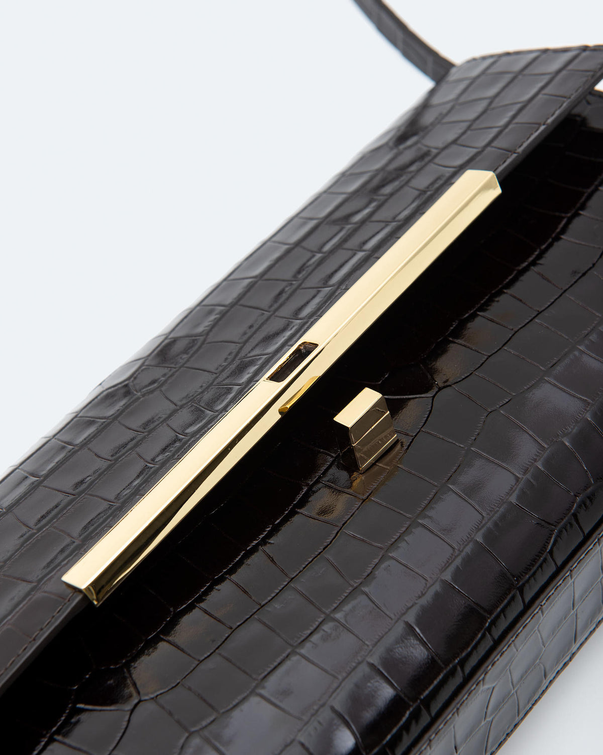 CROCODILE-EFFECT LEATHER CLUTCH BAG