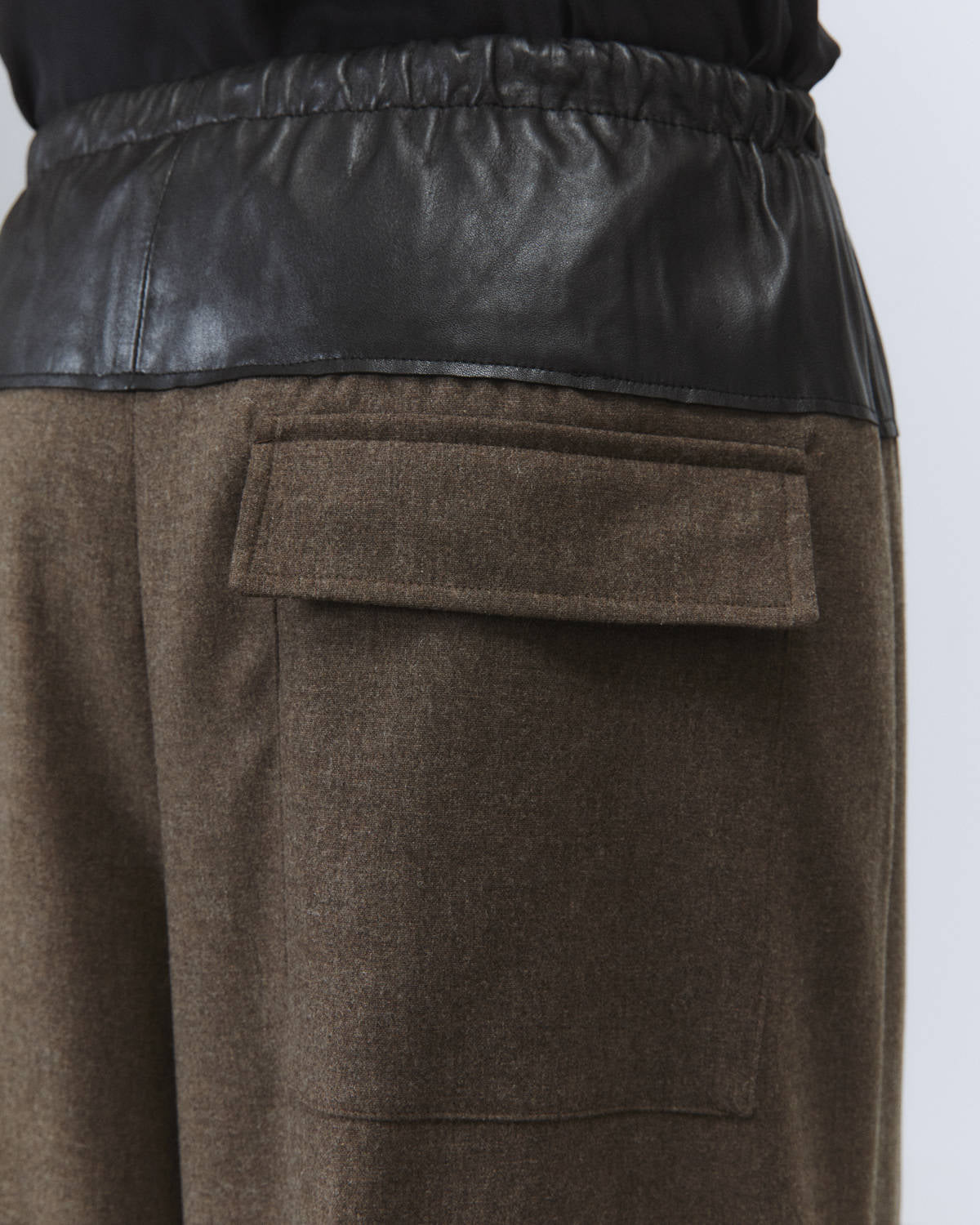 FLANNEL PANTS WITH LEATHER PEPLUM