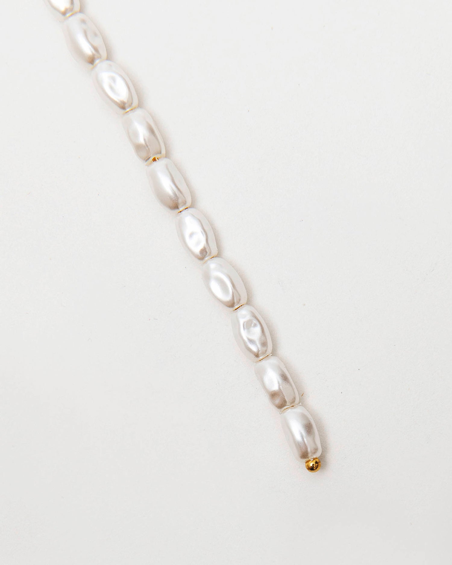 SINGLE EARRING WITH PEARL FRINGE